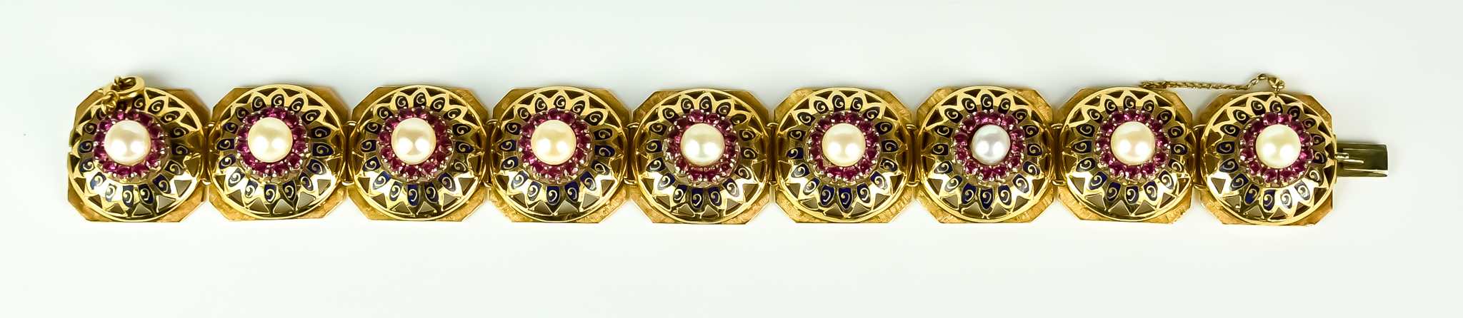 An 18ct Gold Pearl Bracelet, 20th Century, set with cultured pearls, each pearl surrounded by