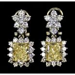 An 18ct Gold Pair of Diamond Earrings, Modern, set with centre yellow diamonds, approximately 1ct
