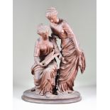 A Brown Patinated Spelter Group of a seated and a standing classical woman with book, on oval