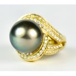 An 18ct Gold Tahitian Pearl and Diamond Ring, Modern, set with a centre Tahitian pearl, 14mm