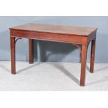 A Mahogany Rectangular Side Table of Georgian Design, with carved edge to top, plain apron on square