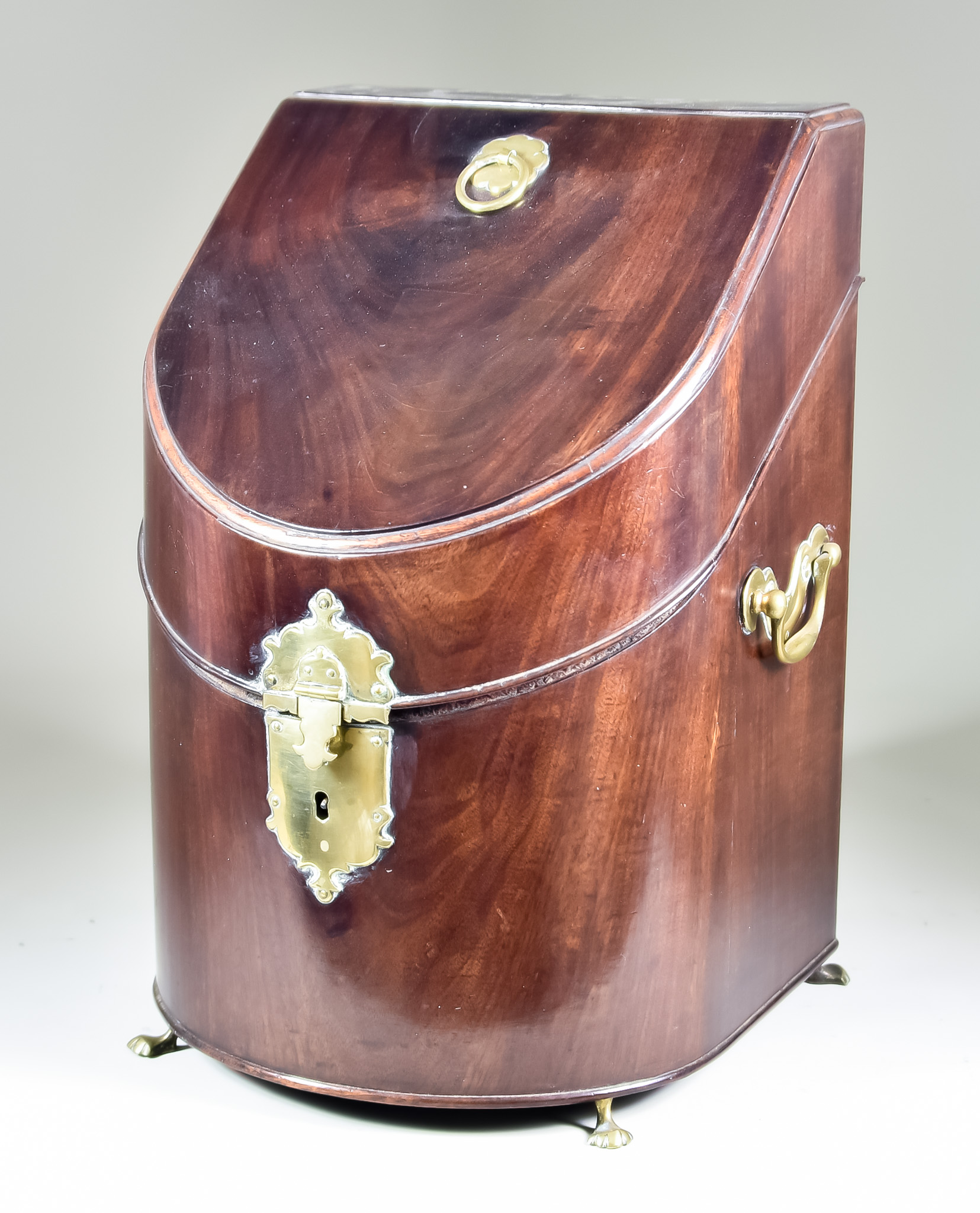 A Mahogany and Brass Mounted Two-Handled Knife Box, George III, with shaped escutcheon and divided
