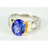 A 14ct White Gold Tanzanite and Diamond Ring, Modern, set in a yellow gold mount with a faceted