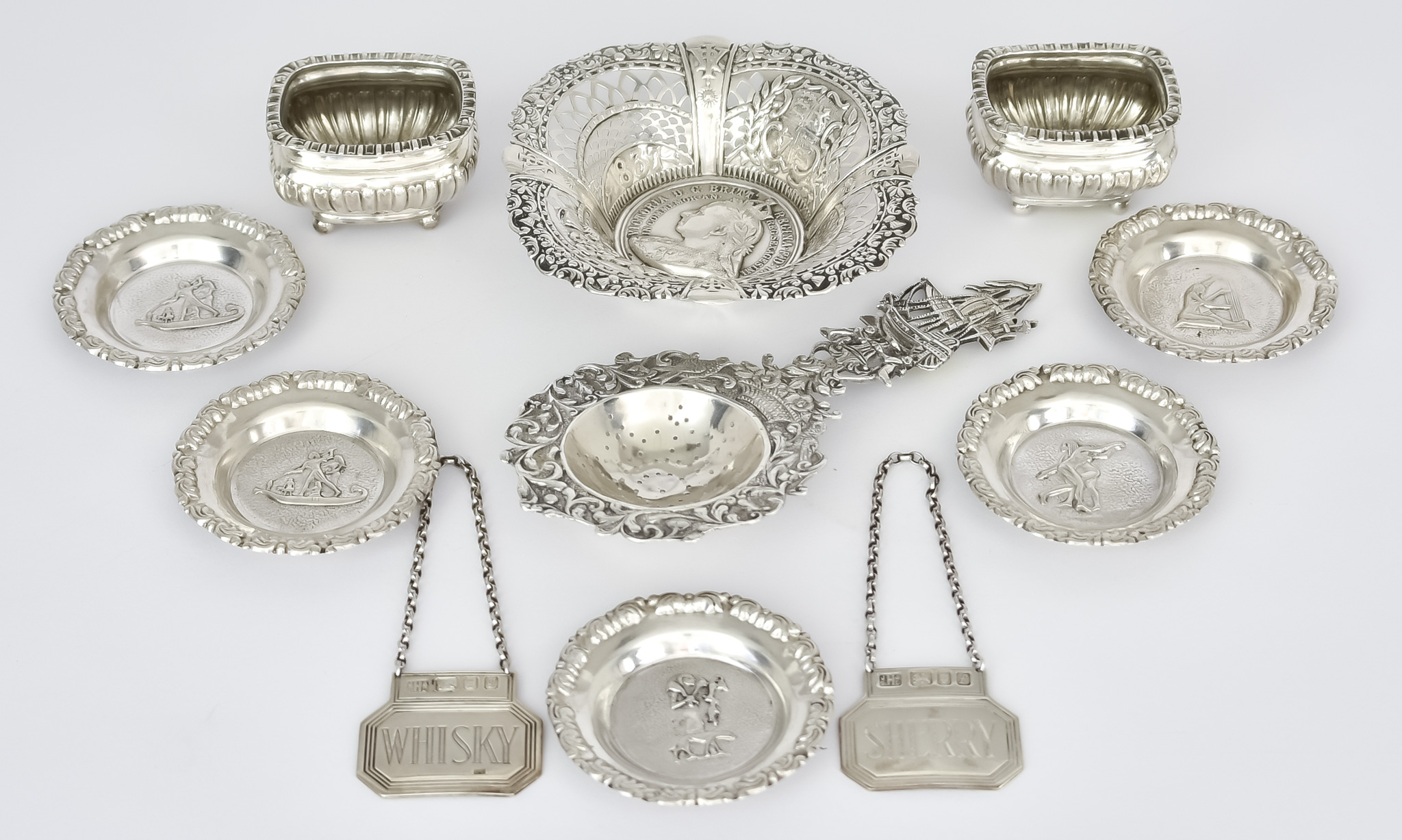 An Early 20th Century Dutch Silver Tea Strainer and Mixed Silverware, the tea strainer with import