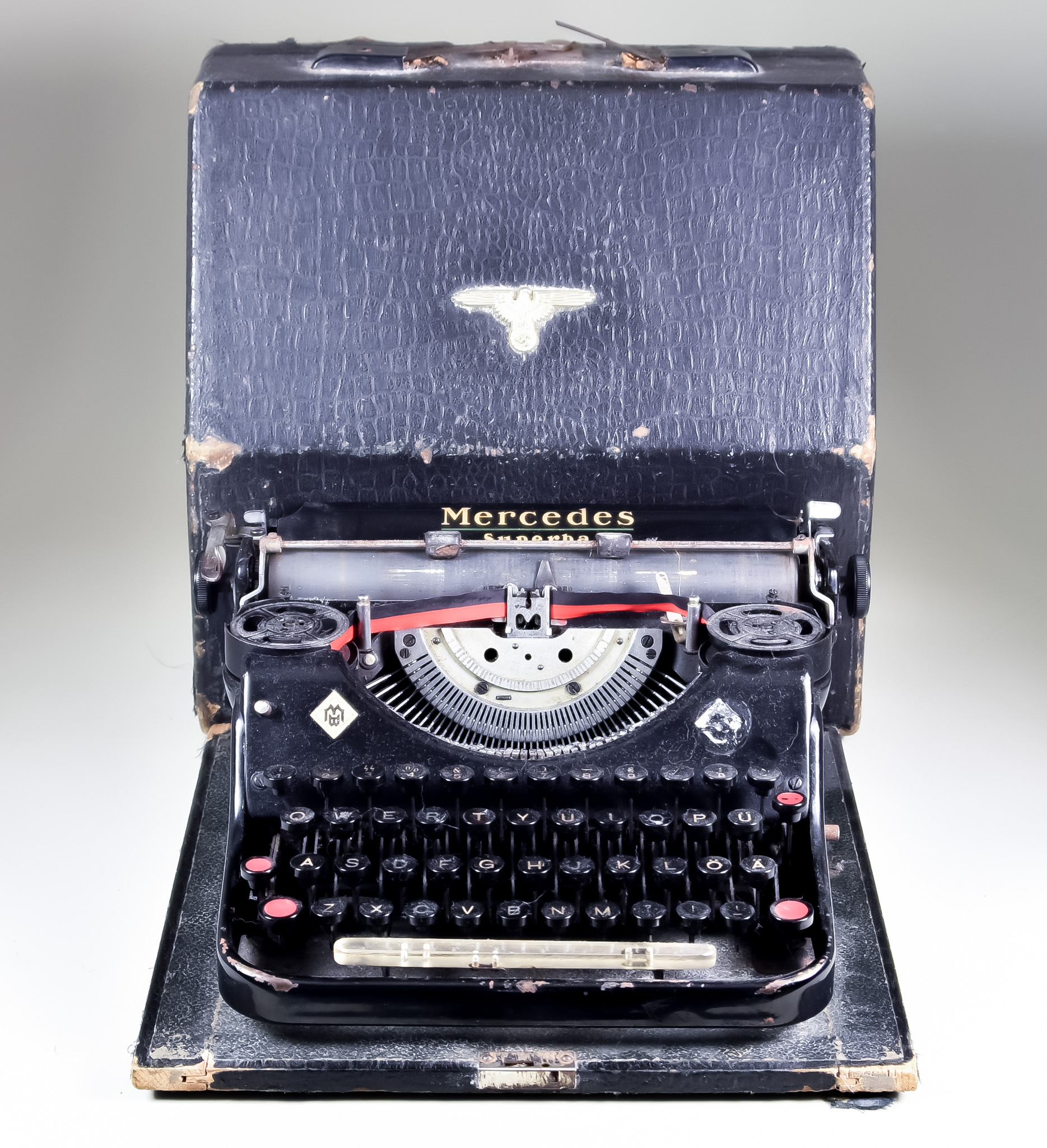 A World War II SS Typewriter, by Mercedes, Model Superba, in portable case, keyboard bears the