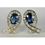 A Pair of Sapphire and Diamond Earrings, Modern, in 18ct white gold mount with clip-on fixings, of