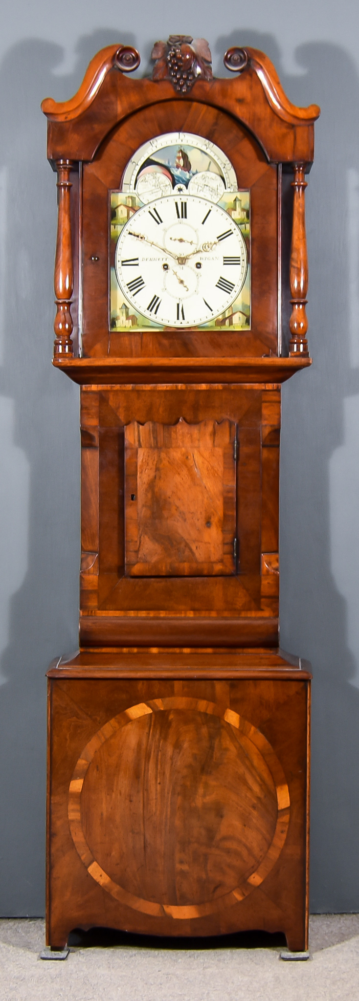 A 19th Century North Country Mahogany Long Case Clock, by Dennett of Wigan, the 14ins arched painted