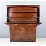 A Late Victorian Dark Oak Dresser of Arts and Crafts Design, retailed by Liberty's, the upper part