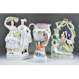 A Staffordshire Pottery Jug and a Selection of Staffordshire Pottery Figures, the jug worded "John