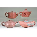 Four Chinese Yixing Stoneware Teapots and Covers, including reticulated and moulded with storks