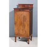 An Edwardian Mahogany Pedestal Cupboard, inlaid with stringings with upstand and moulded edge to