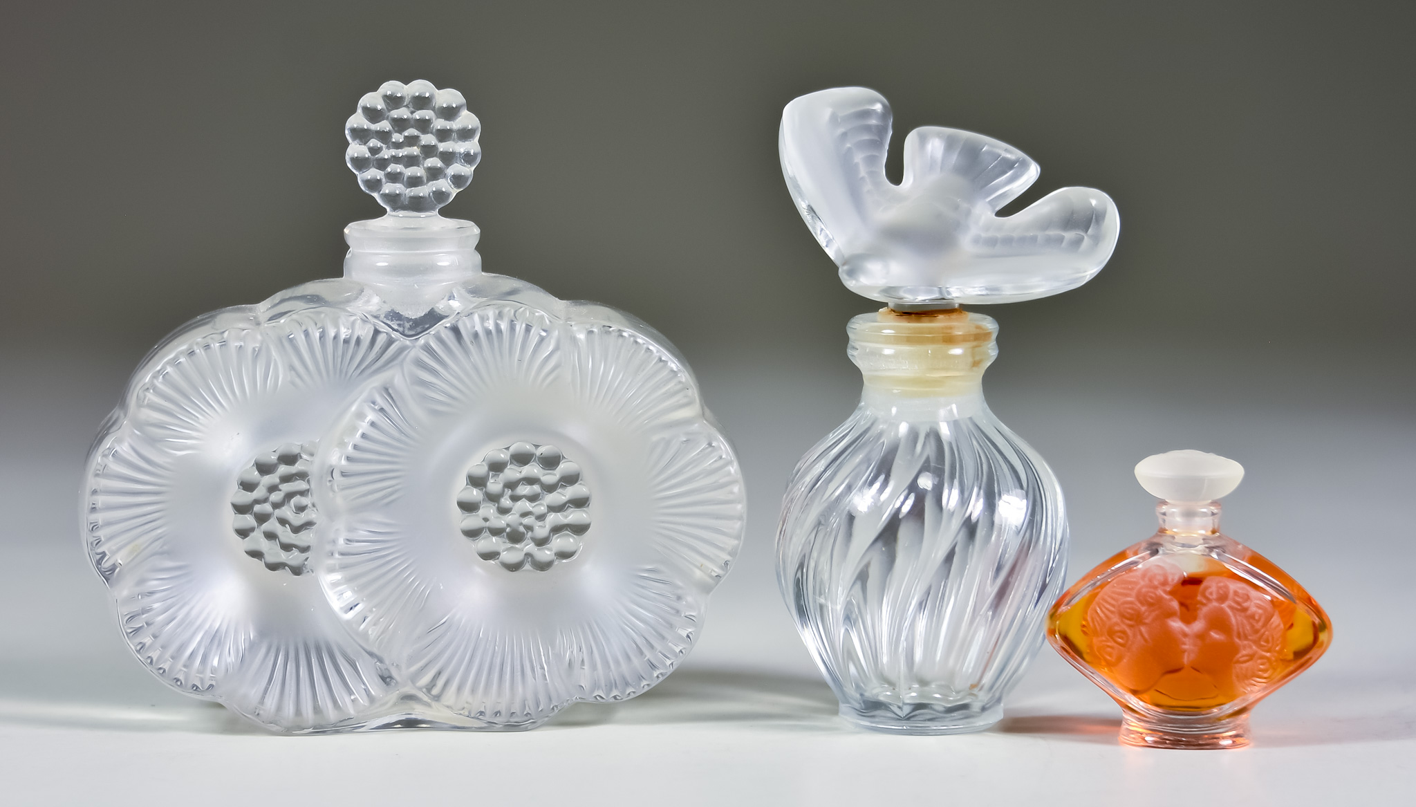 Three Lalique Clear and Frosted Glass Scent Bottles, including "Deux Fleurs" bottle and stopper, 3.