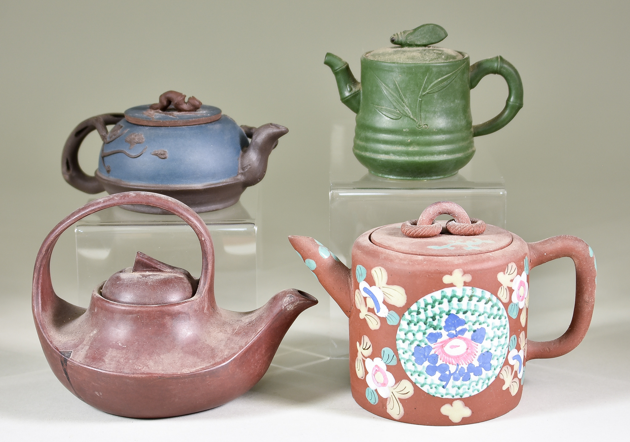 Four Chinese Yixing Stoneware Teapots and Covers, including - example enamelled in colours with