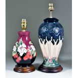 Two Moorcroft Pottery Table Lamps on Wooden Bases, one decorated in Cluny design on a pale pink