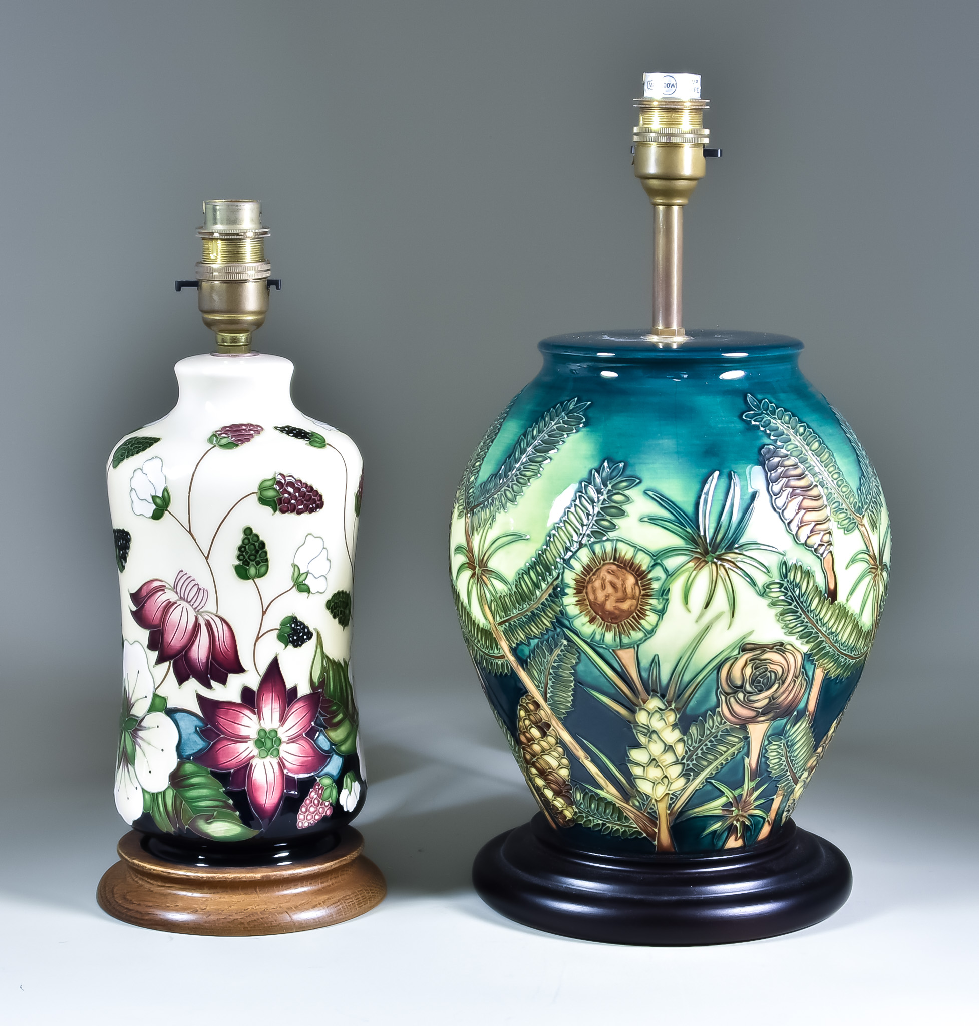 Two Moorcroft Pottery Table Lamps on Wooden Bases, one decorated in Amazon Twilight design, 9ins