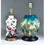 Two Moorcroft Pottery Table Lamps on Wooden Bases, one decorated in Amazon Twilight design, 9ins