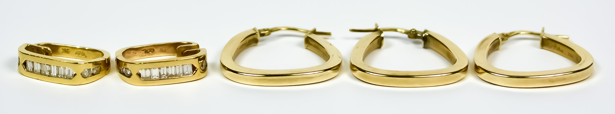 A Pair of 18ct Gold Earrings, Modern, set with small baguette diamonds, for pierced ears, gross