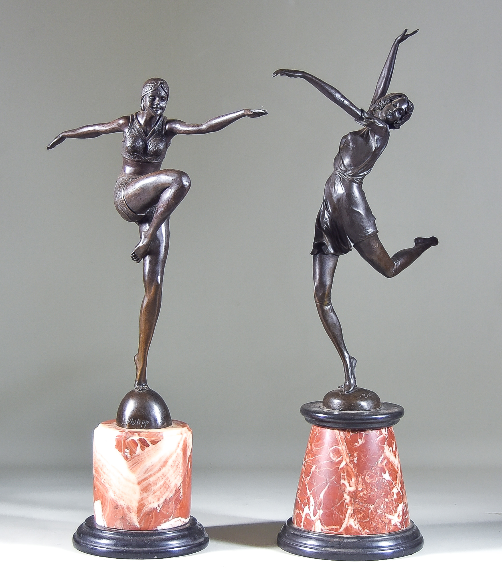 20th Century French School - Two Bronze Figures of Dancing Women of Art Deco design, each on red and