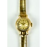 A 9ct Gold Lady's Manual Wind Wristwatch by Omega, champagne dial, 18mm diameter, with gold baton