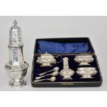 An Edward VII Silver Four-Piece Condiment Set and a George V Silver Sugar Caster, the condiment