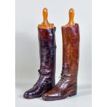 A Pair of Brown Leather Hobnailed Riding Boots, with a pair of wooden boot trees