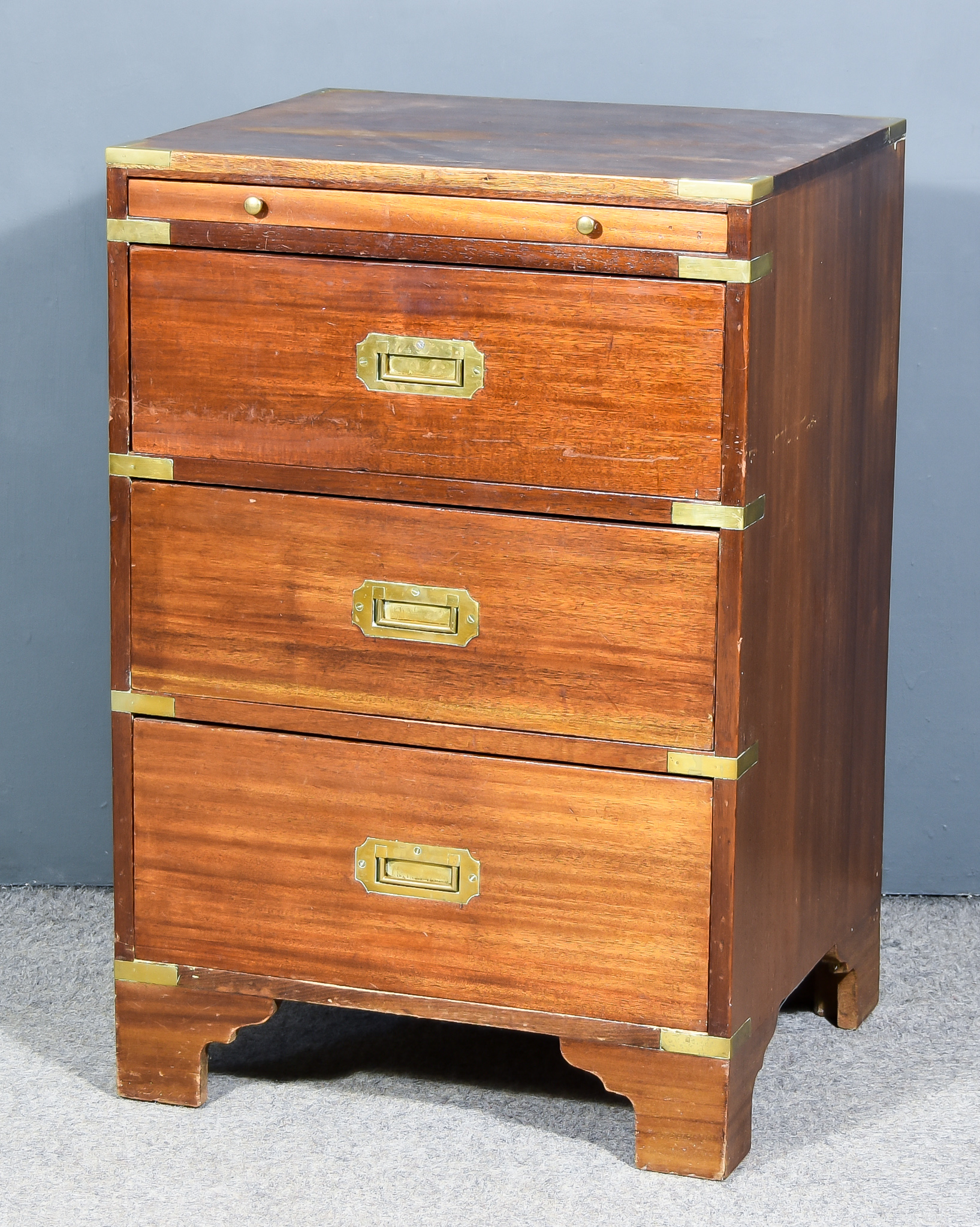 A 20th Century Mahogany and Brass Bound Military Style Chest, with baize-lined slide, fitted three