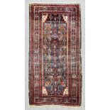 A 20th Century Shirvan Rug, woven in colours, the field filled with stylised floral and geometric