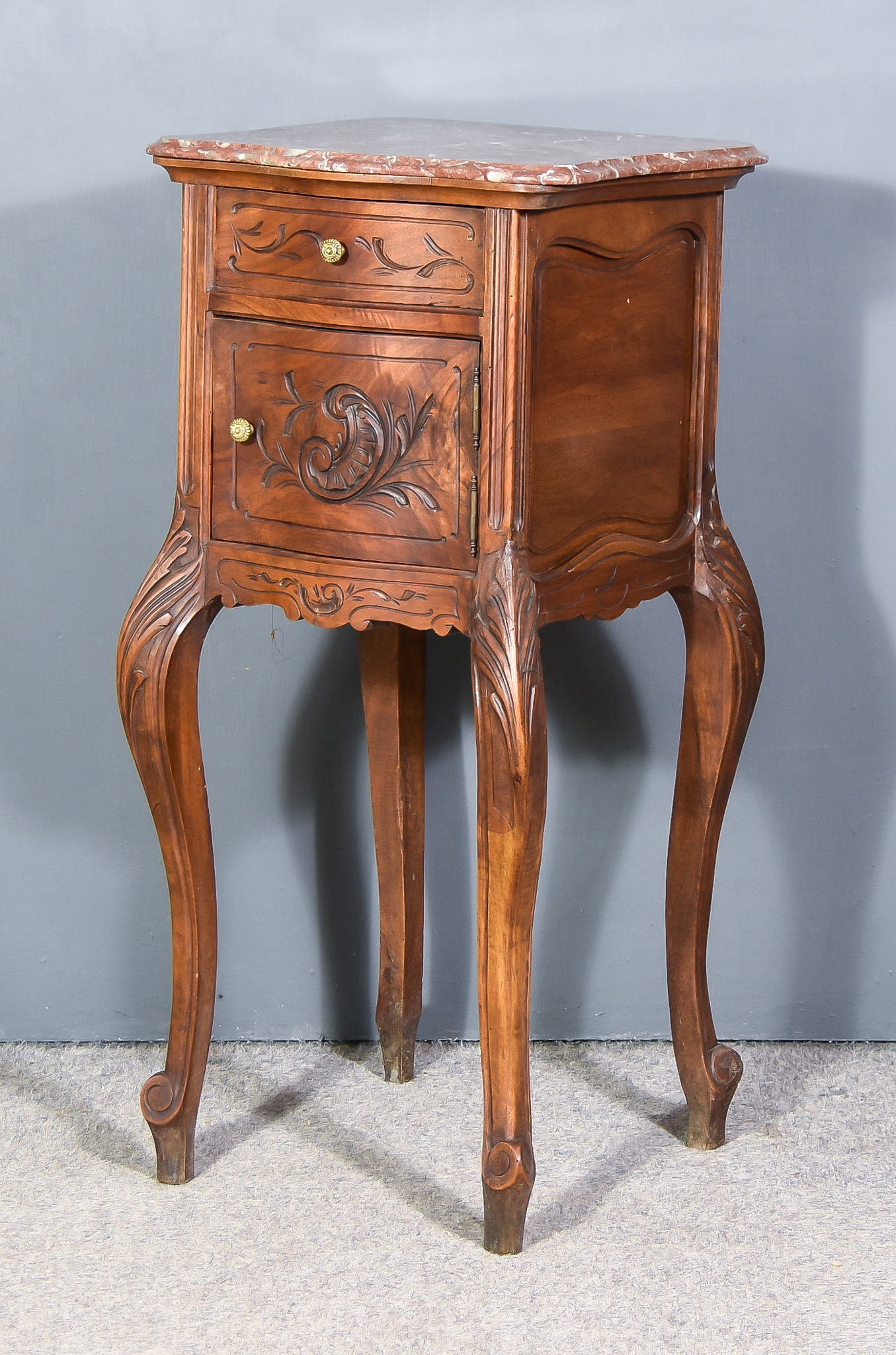 A 19th Century French Panelled Fruitwood Serpentine Fronted Bedside Cabinet, with red, white and