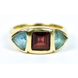 An 18ct Gold Gem Set Ring, set with three coloured faceted stones, size O, gross weight 6.7g