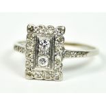 A Platinum Diamond Shield Ring, Early 20th Century, pave set with small brilliant cut white