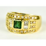 An 18ct Gold Emerald and Diamond Ring, Modern, set with a centre emerald, approximately .50ct,