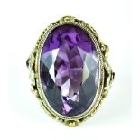 An Amethyst Dress Ring, in silvery metal mount, set with a faceted oval amethyst, 18mm x 28mm, the