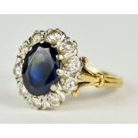 An 18ct Gold Sapphire and Diamond Ring, Modern, set with a centre faceted sapphire, approximately