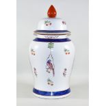 A Continental Porcelain Vase and Cover in the Chinese Manner and of Large Proportions, enamelled