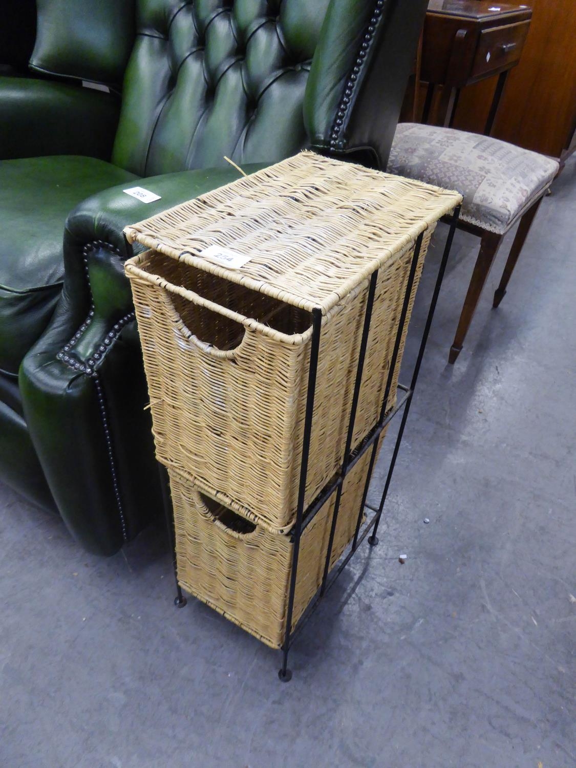 A BLACK WIRE PATTERN STORAGE CHEST WITH TWO WICKER DRAWERS