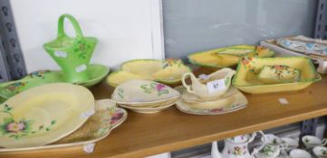 A collection of 1930s Crown Devon pottery, moulded with garden wall pattern with yellow, cream or