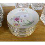 A SET OF 12 ROSENTHAL, GERMAN PORCELAIN SIDE PLATES, painted with lily sprays, 6? diameter