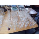 QUANTITY OF DRINKING GLASSES, SIX CUT GLASS SHERRY GLASSES, ETCHED GLASSES AND VARIOUS DRINKING