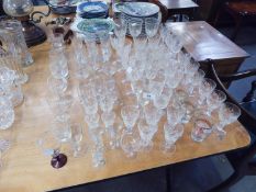 QUANTITY OF DRINKING GLASSES, SIX CUT GLASS SHERRY GLASSES, ETCHED GLASSES AND VARIOUS DRINKING