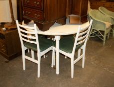 A WHITE FINISH CIRCULAR KITCHEN TABLE AND A SET OF FOUR LADDER BACK SINGLE CHAIRS