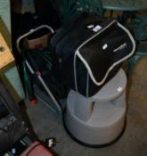 A GARDEN HOSE, ON PORTABLE REEL, A 'DIAMONDBRITE' CAR CLEANING KIT, IN BLACK CANVAS BAG AND A