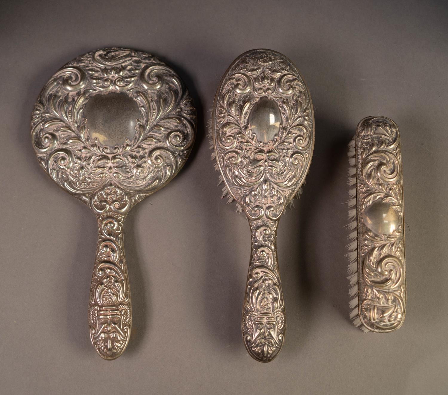 STAMPED SILVER BACKED LADY'S DRESSING TABLE SET of hand mirror, clothes brush and hair brush,