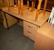 A BLOND BEECHWOOD SINGLE PEDESTAL DESK WITH THREE DRAWERS, BLACK METAL FRAME AND LEGS, 4' X 2'8"