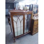 A WALNUT WOOD DWARF DISPLAY CABINET WITH LEDGE BACK, SLIGHTLY BOWED FRONT ENCLOSED BY TWO ASTRAGAL