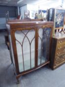 A WALNUT WOOD DWARF DISPLAY CABINET WITH LEDGE BACK, SLIGHTLY BOWED FRONT ENCLOSED BY TWO ASTRAGAL