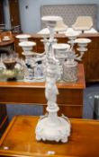 WHITE PAINTED CAST IRON SIX BRANCH, SEVEN LIGHT CANDELABRUM, modelled with a cherub, on a