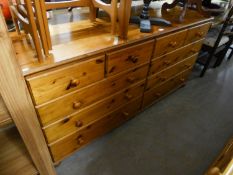 A MODERN PINE DRESSER WITH TEN DRAWERS, WITH WOODEN KNOB HANDLES, 5?6? WIDE