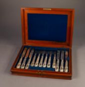 LATE VICTORIAN MAHOGANY CASED SET OF NINE WHITE METAL HANDLED KNIVES AND TEN FORKS, filled,