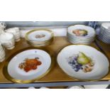 A SET OF SIX BAVARIAN CHINA FRUIT PRINTED dessert plates and a serving plate with broad gilt rims; a