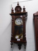 MODERN MAHOGANY FRAMED VIENNA WALL CLOCK, HAVING WHITE ROMAN NUMERAL  DIAL WITH KEY AND PENDULUM